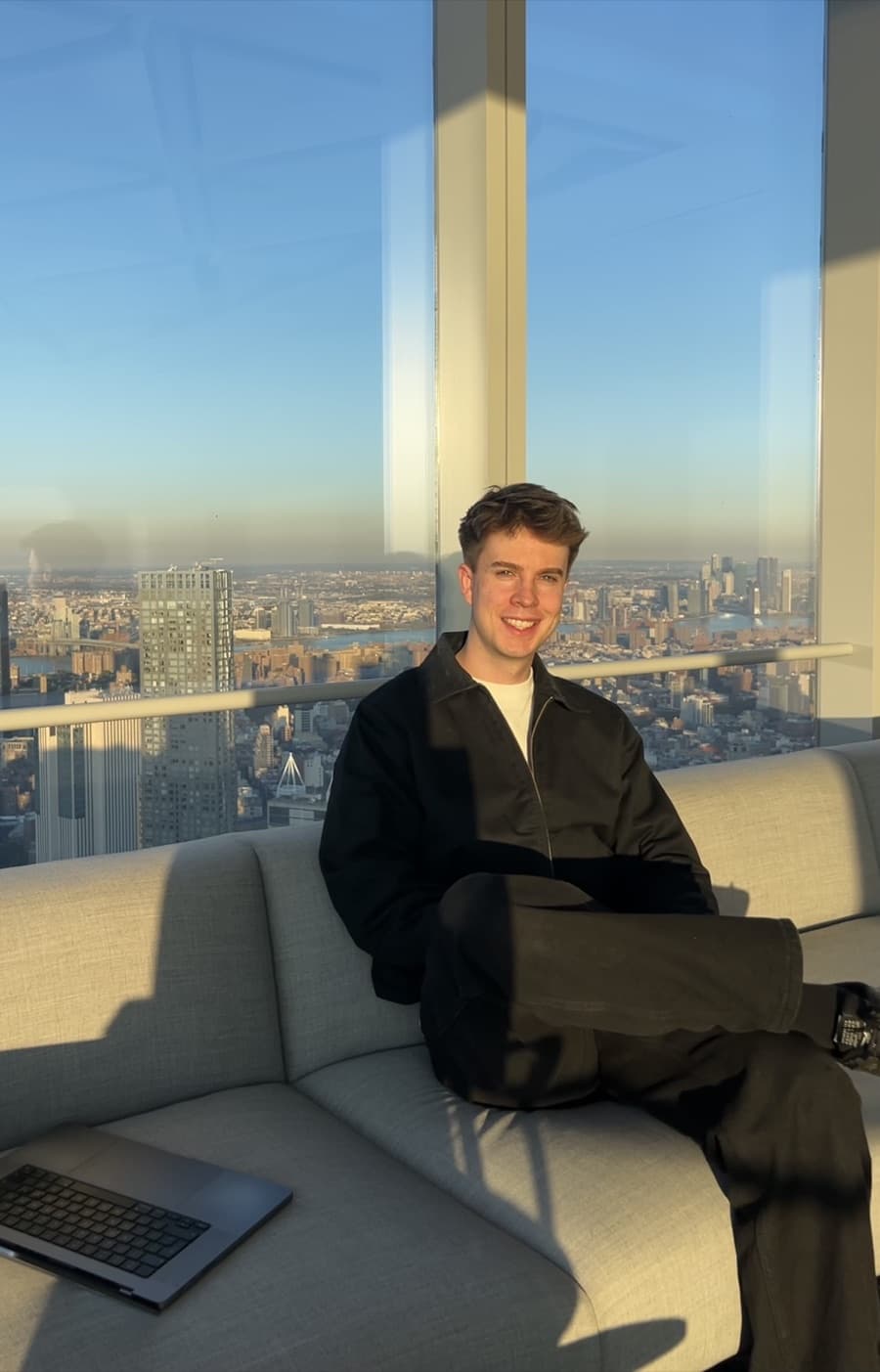 Russell Cook by a window overlooking London